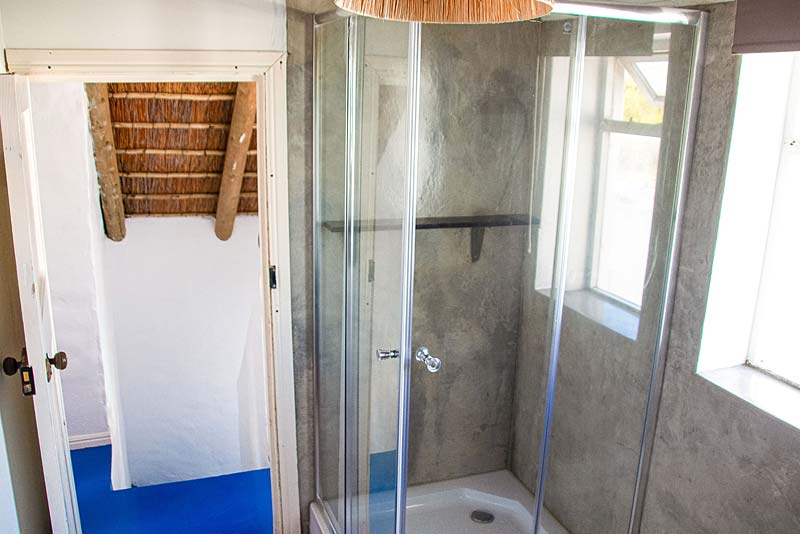 The Thatch apartment bathroom with shower