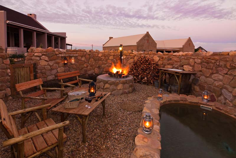 Lovely boma with braai area and plunge pool at Karoo View Cottages