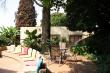 Tranquil garden with lovely shady patio with barbeque facilities and patio bar where guests can rela