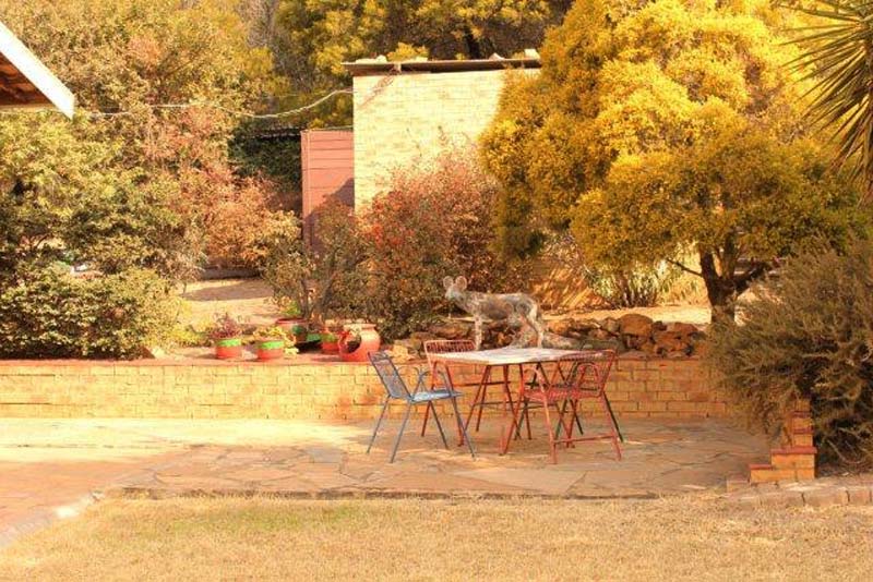 Relaxing in front of rooms - Hildes B&B Tierpoort, south-east Pretoria