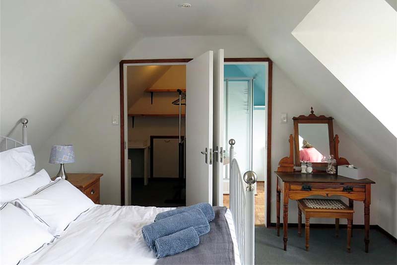 The Loft Room showing the closet and bathroom doors