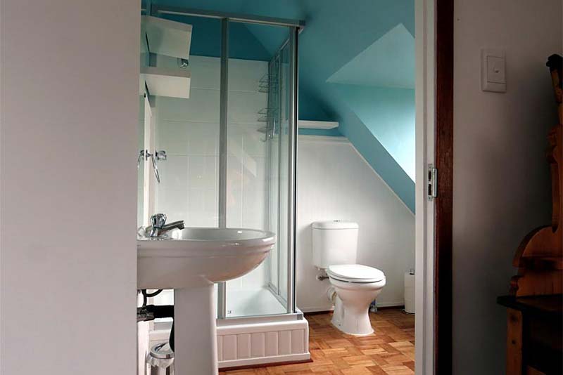 The bathroom which has a shower, basin and toilet