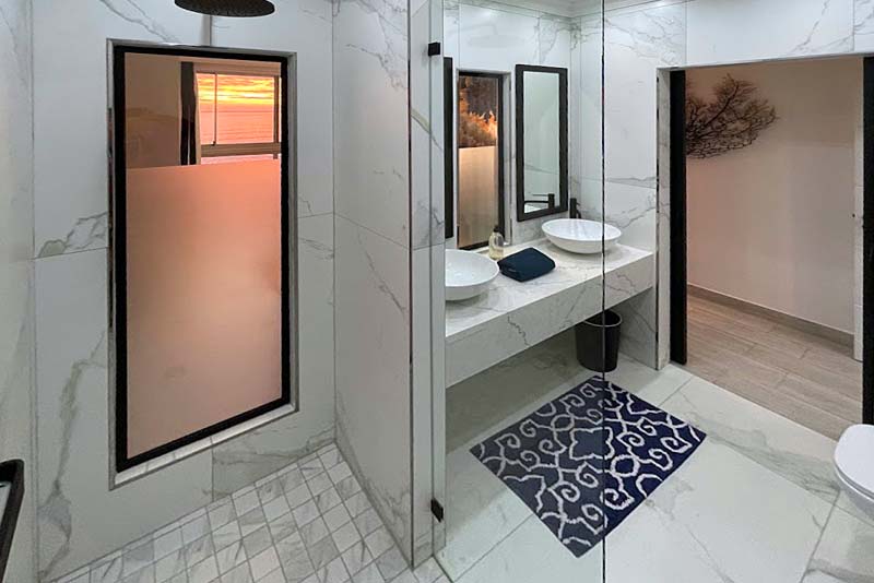 Ensuite bathroom with big shower and double vanities.